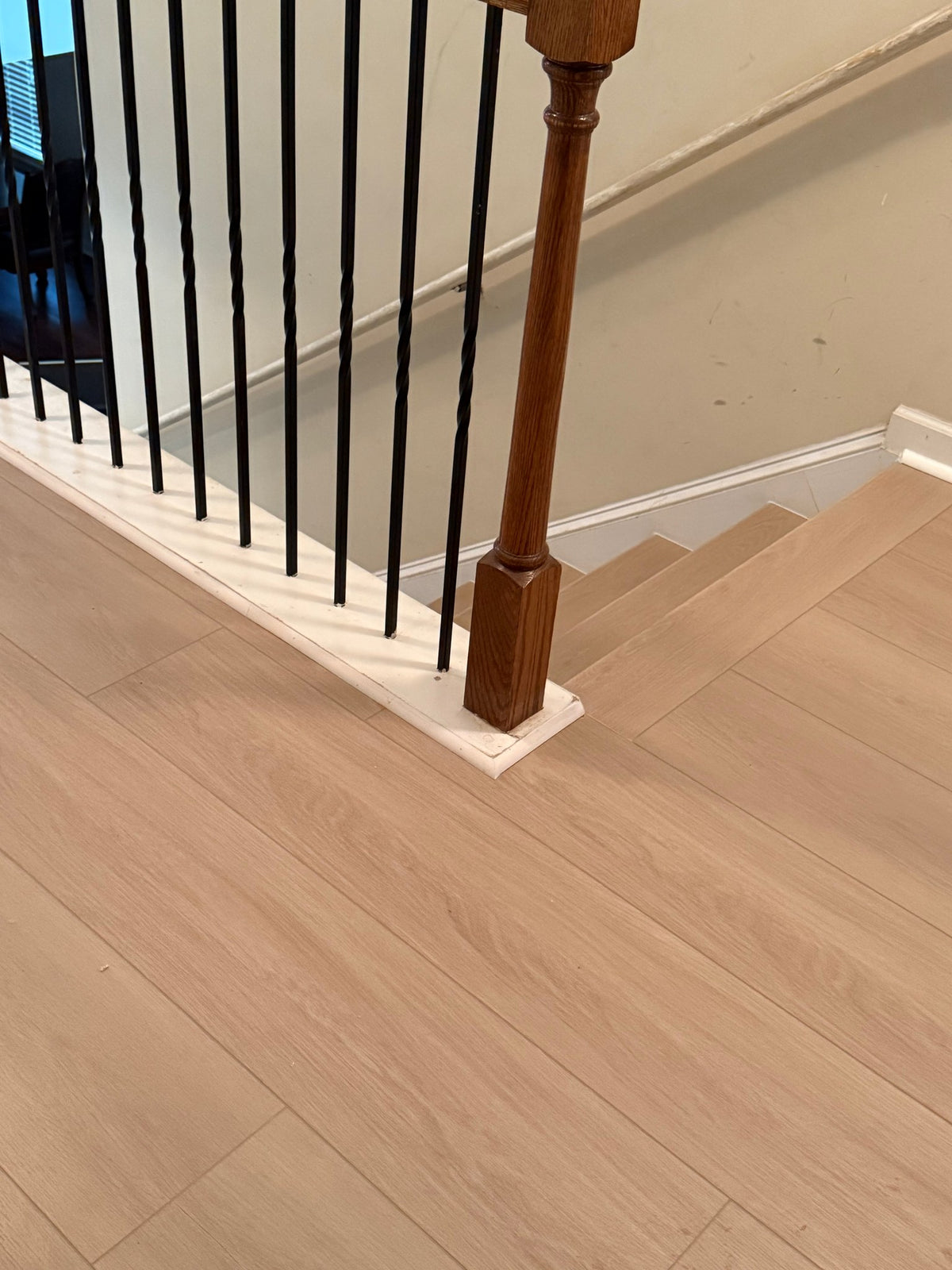 Valinna NYF wood-look SPC by Lexi, installed floor photo, stair landing