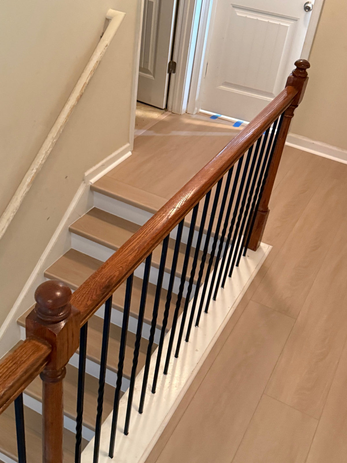Valinna NYF wood-look SPC by Lexi, installed floor photo, stairs