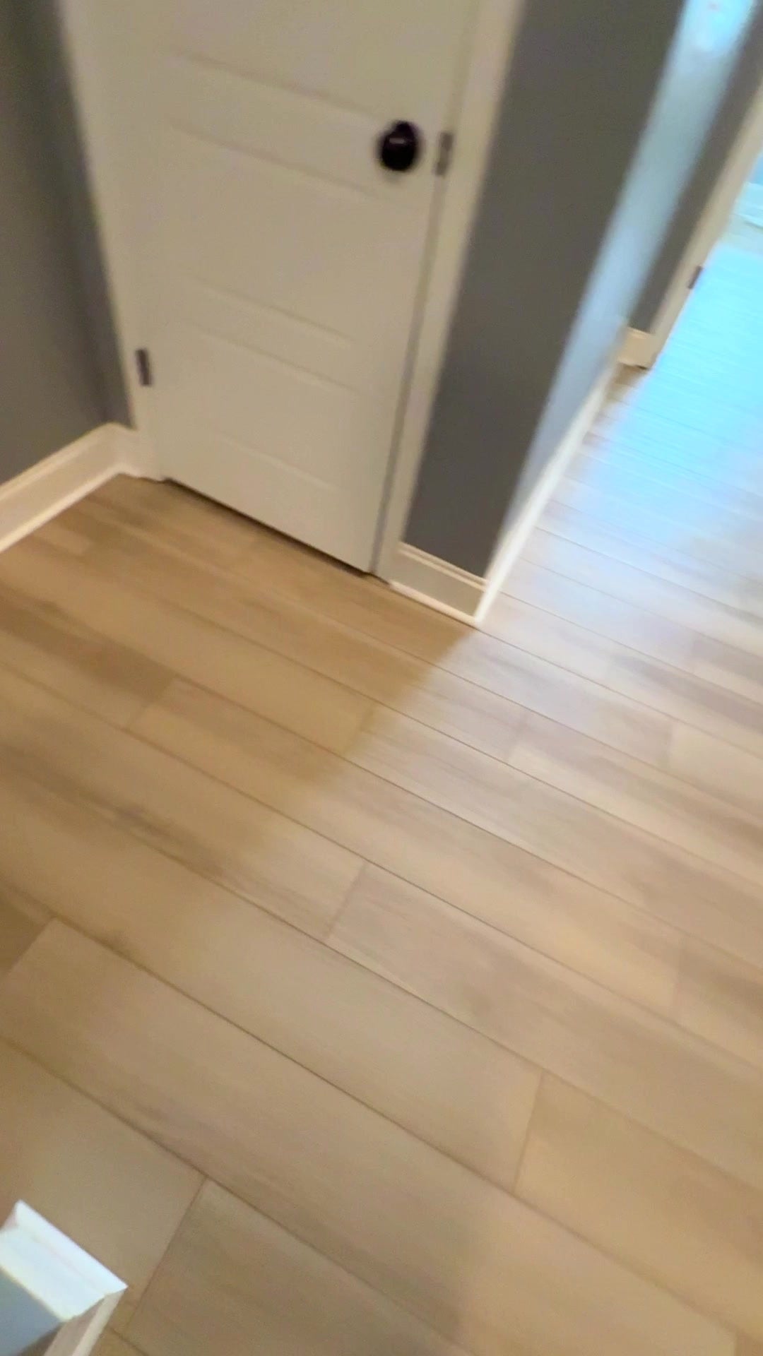 Wood-look LVP landing floor by the doors, Commerce GA