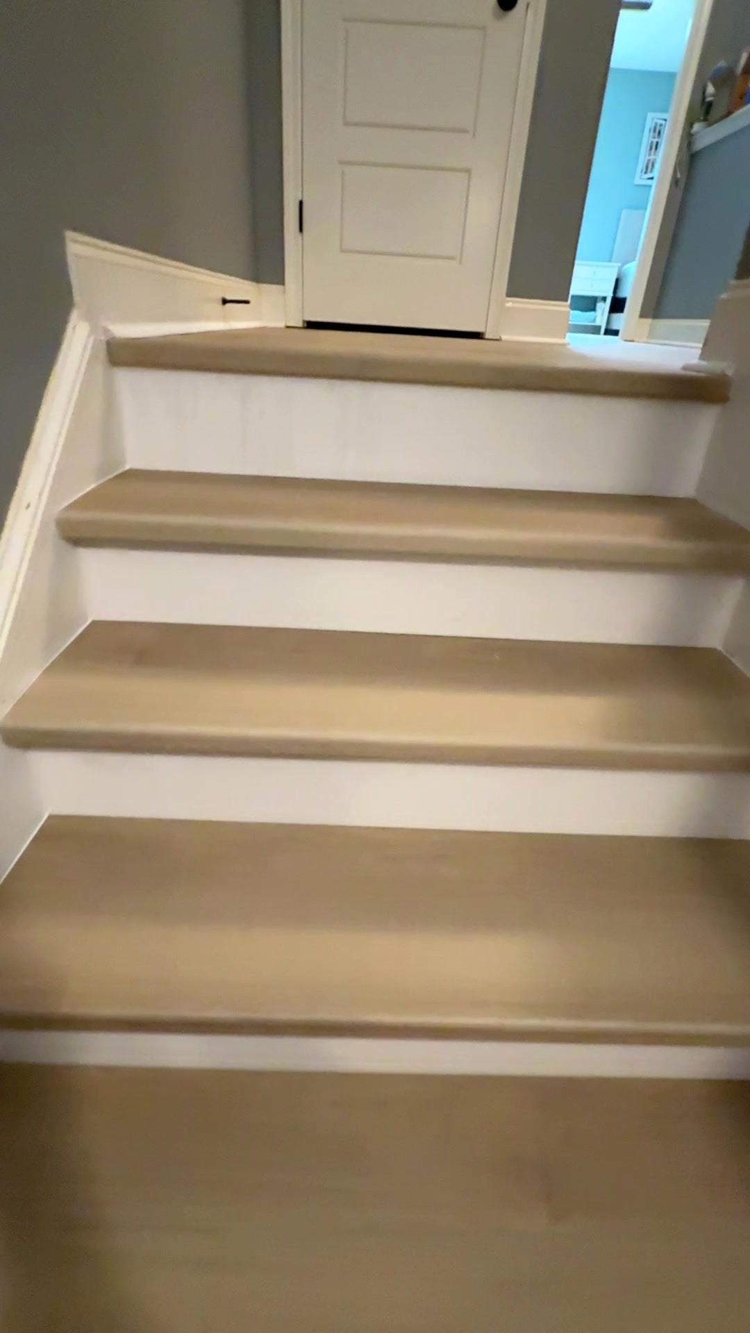 Stair treads meeting the LVP landing floor, Commerce GA